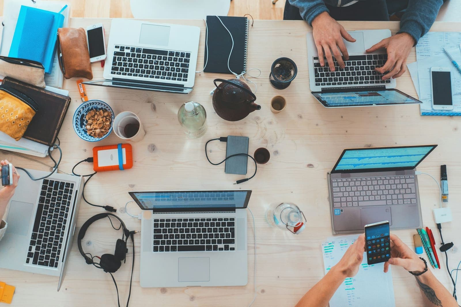Overhead view of laptops on a shared desk