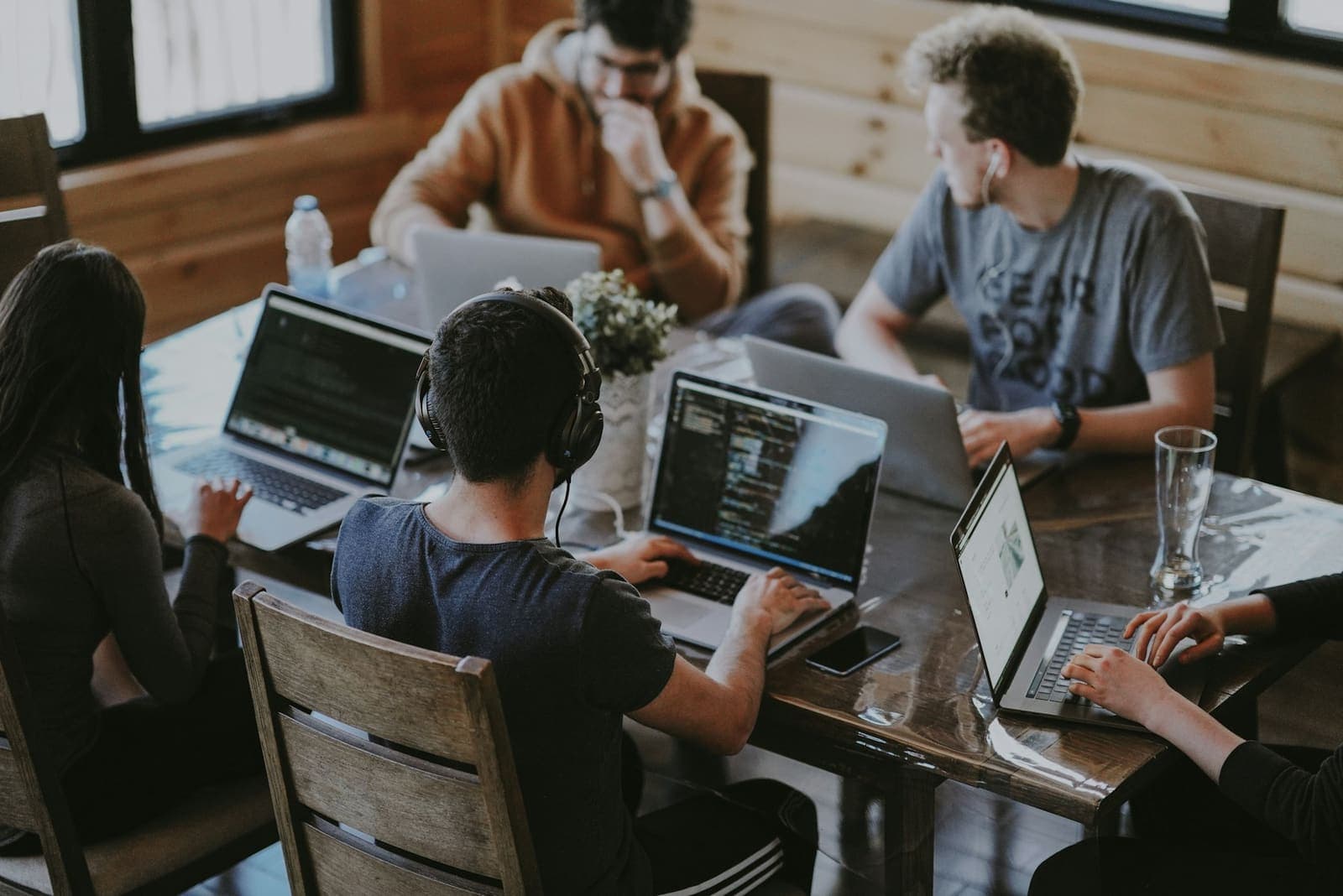 Engineers reviewing work together at a shared desk